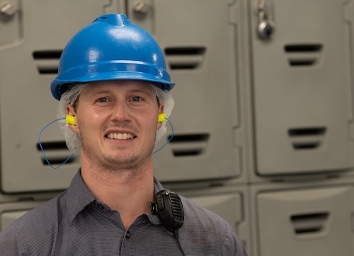 Worker in front of lockers